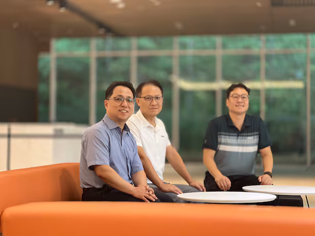 (From left) IMGT co-CEOs Lee Hak-jong and Son Geon-ho with staff./Courtesy of IMGT